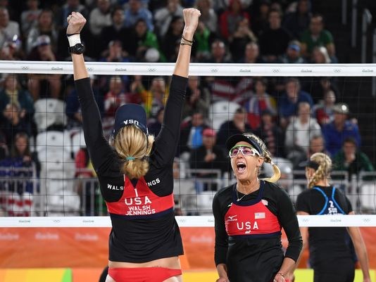 Kerri Walsh Jennings and April Ross celebrate a victory