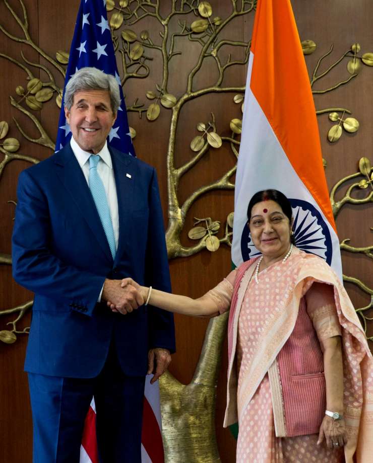 Indian Foreign Minister Sushma Swaraj right shakes hand with U.S. Secretary of State John Kerry in New Delhi India Tuesday Aug. 30 2016. Kerry is on a three-day visit to India