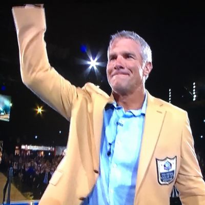 Kiln native Brett Favre waves to the crowd after being inducted into the Pro Football Hall of Fame on Saturday