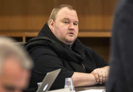 German tech entrepreneur Kim Dotcom sits in a chair during a court hearing in Auckland New Zealand