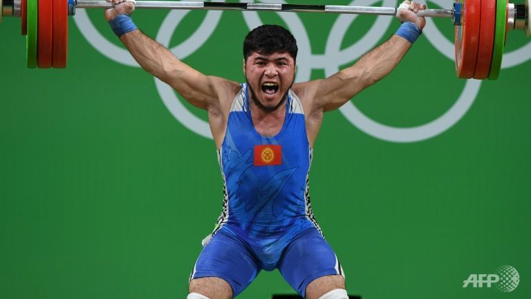 Kirghyzstan's Izzat Artykov competes in the men's 69kg weightlifting competition at Rio