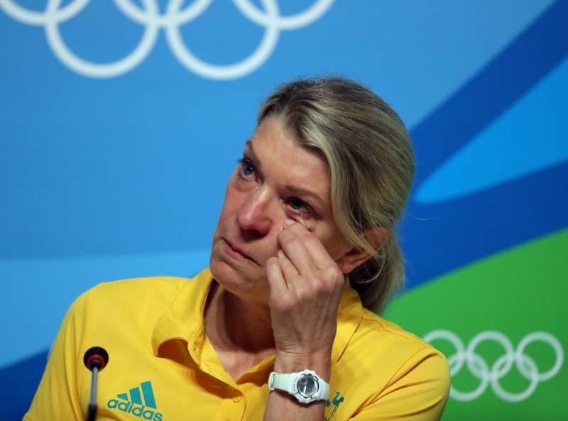 Kitty Chiller Chef de Mission for Australia at the Rio 2016 Olympic Games wipes her eyes during a press conference in which she spoke about the fines levied against a group of their athletes for entering the basketball arena without proper accreditation