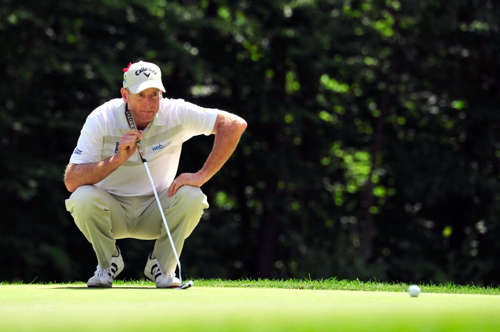 CROMWELL CT- AUGUST 07 Jim Furyk of the United States lines up his put on the 15th green during the final round of the Travelers Championship at TCP River Highlands