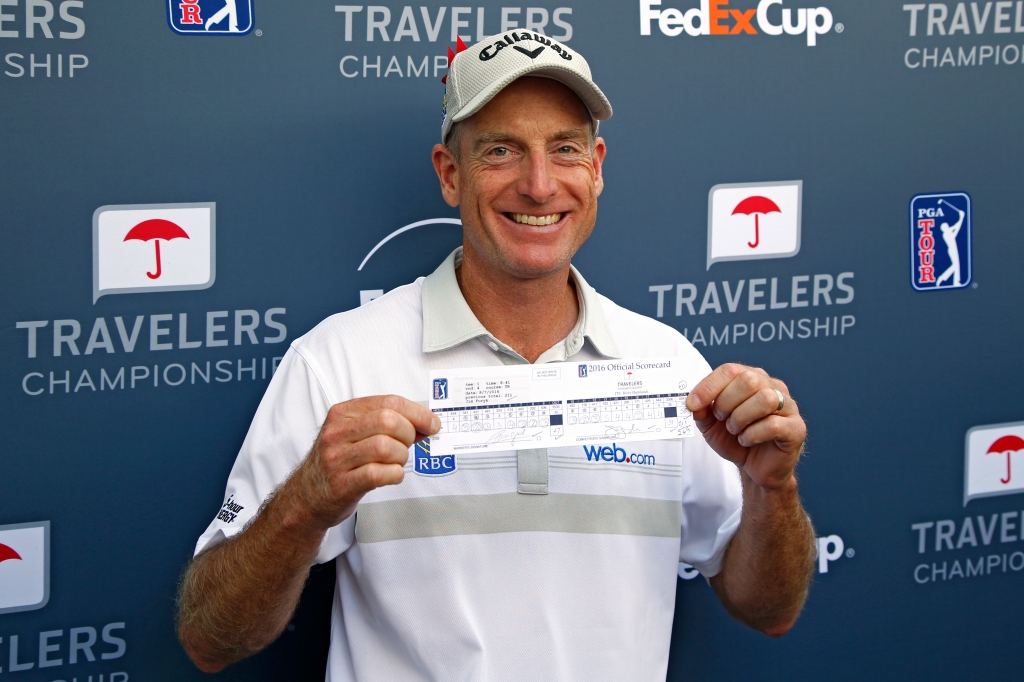 CROMWELL CT- AUGUST 07 Jim Furyk of the United States poses with his scorecard after shooting a record setting 58 during the final round of the Travelers Championship at TCP River Highlands