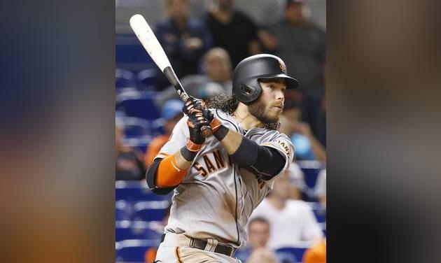 San Francisco Giants&#039 Brandon Crawford watches the ball as he hits a triple during the 13th inning of a baseball game against the Miami Marlins Monday Aug. 8 2016 in Miami. The Giants defeated the Marlins 8-7 early Tuesday in 14 innings. Crawfor