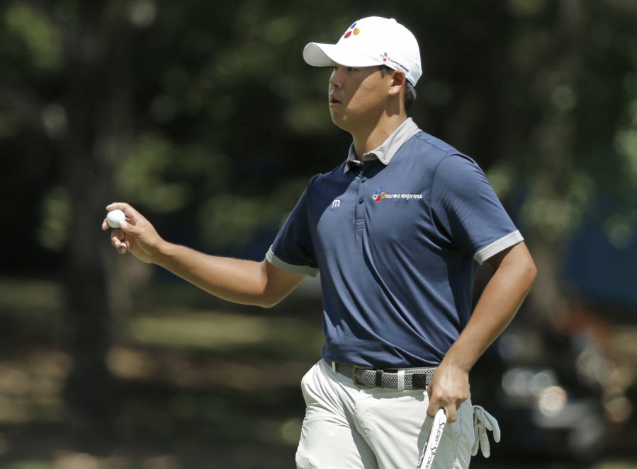 Si Woo Kim acknowledges the crowd after making a birdie putt on the first hole during the third round of the Wyndham Championship golf tournament in Greensboro N.C. Saturday Aug. 20 2016