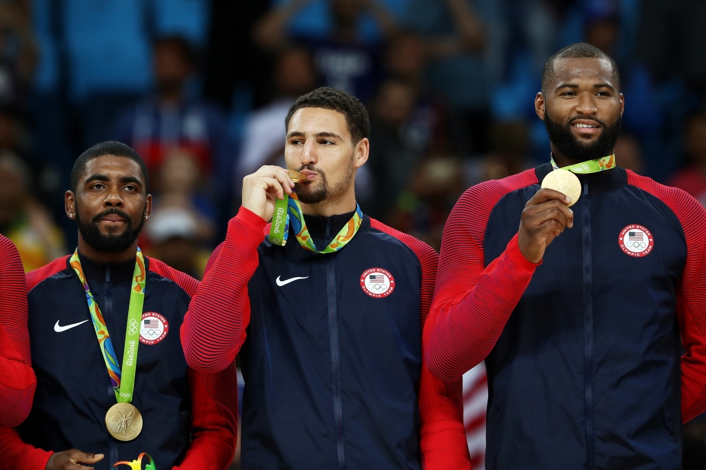 Kyrie Irving Klay Thompson and Demarcus Cousins celebrate their new gold