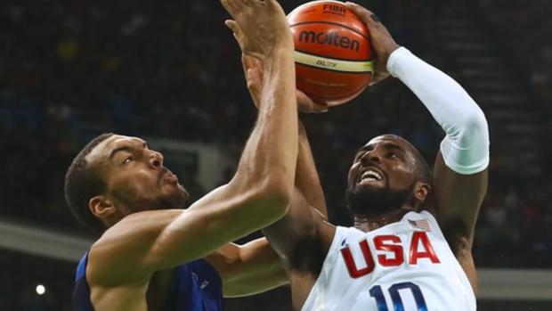 Kyrie Irving of the U.S. shoots over Rudy Gobert of France on Aug. 14. REUTERS  Jim Young