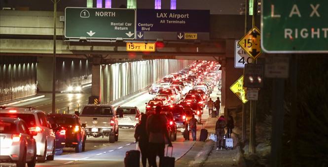 The Latest Investigators focus on 911 call before LAX panic