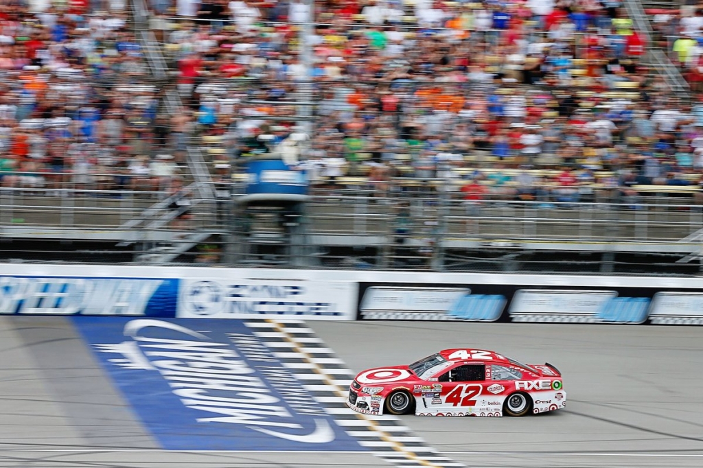 Larson takes advantage of late restart for first Cup victory