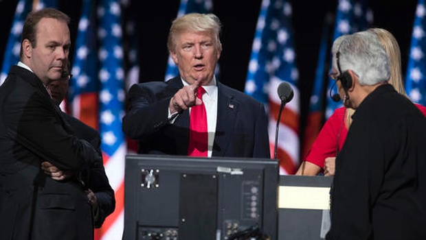 Republican presidential candidate Donald Trump center accompanied by Trump campaign aide Rick Gates left prepares for his speech at the Republican National Convention in Cleveland