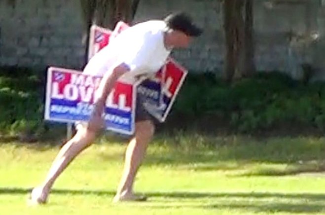 A frame grab from a video shows State Rep. Curry Todd removing competitor Mark Lovell's campaign signs from the side of the road. Todd has acknowledged that he removed the signs and said he had the right to do