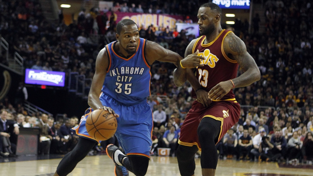 CLEVELAND OH- DECEMBER 17 Kevin Durant #35 of the Oklahoma City Thunder drives to the basket against Le Bron James #23 of the Cleveland Cavaliers during the first half of their game