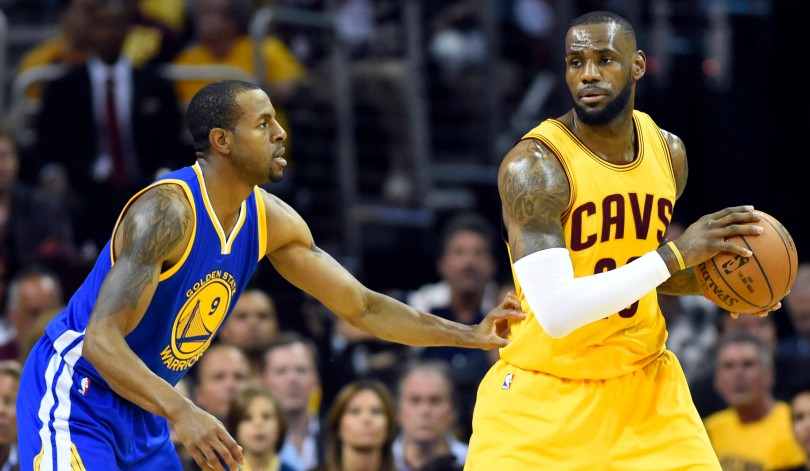 Jun 11 2015 Cleveland OH USA Cleveland Cavaliers forward Le Bron James handles the ball against Golden State Warriors guard Andre Iguodala during the first quarter in game four of the NBA Finals at Quicken Loans Arena. Mandatory Credit Bob D