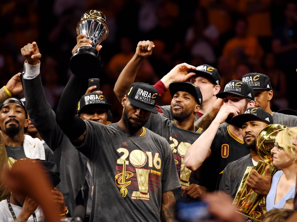 Jun 19 2016 Oakland CA USA Cleveland Cavaliers forward Le Bron James celebrates with the Bill Russell MVP Trophy after beating the Golden State Warriors in game seven of the NBA Finals at Oracle Arena. Mandatory Credit Bob Donnan-USA TODAY Sport