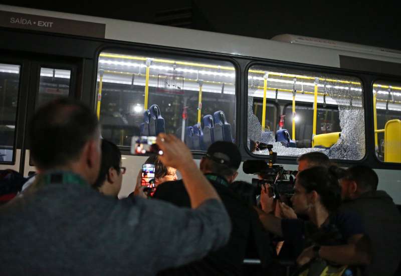 Broken windows on an official media bus after they shattered when driving accredited journalists to the Main Transport Mall from the Deodoro venue of the Rio 2016 Olympic Games in Rio de Janeiro