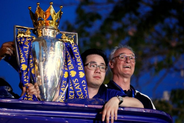 Leicester vice-chairman Aiyawatt Srivaddhanaprabha and Ranieri celebrate the spoils of a symbiotic relationship. — Reuters file pic