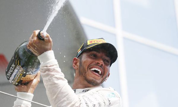 Lewis Hamilton celebrates winning in Hungary to top the driver standings