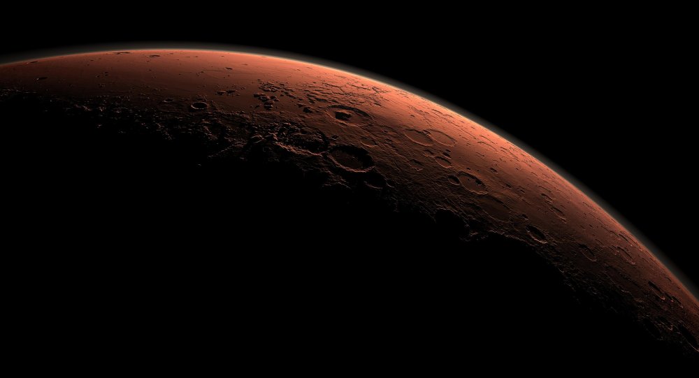 This computer-generated view depicts part of Mars at the boundary between darkness and daylight with an area including Gale Crater beginning to catch morning light in this handout image provided by NASA