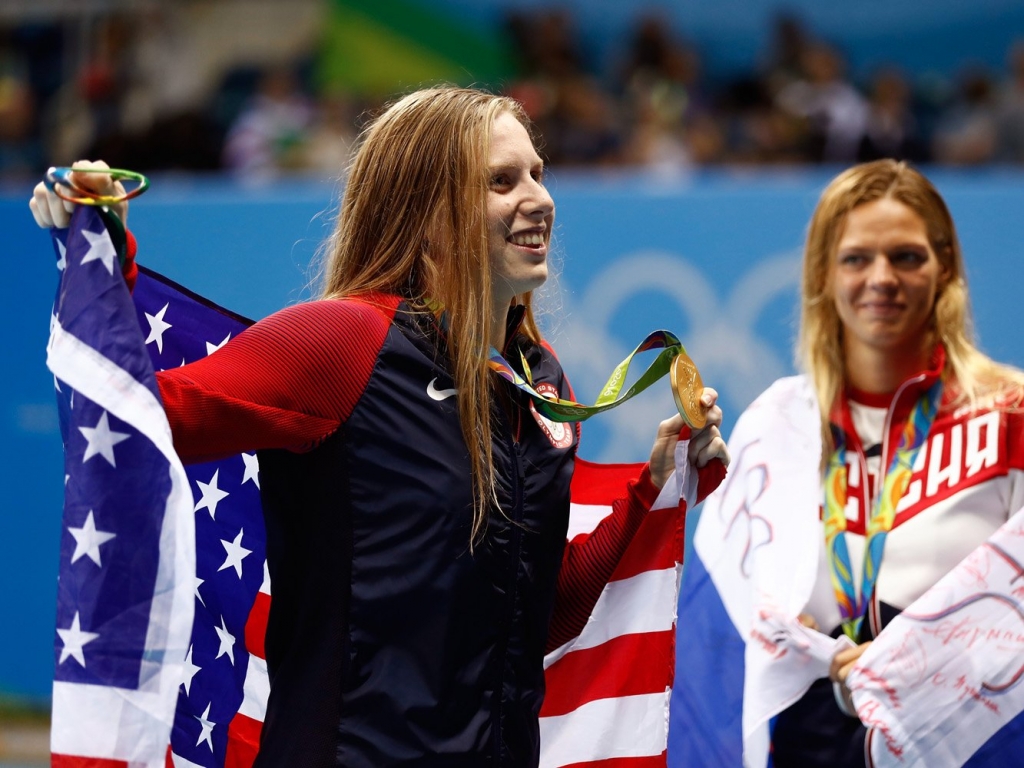 Lilly King accepts her gold medal in the 100-meter breaststroke with silver medalist Yulia Efimova.   Clive Rose  Getty