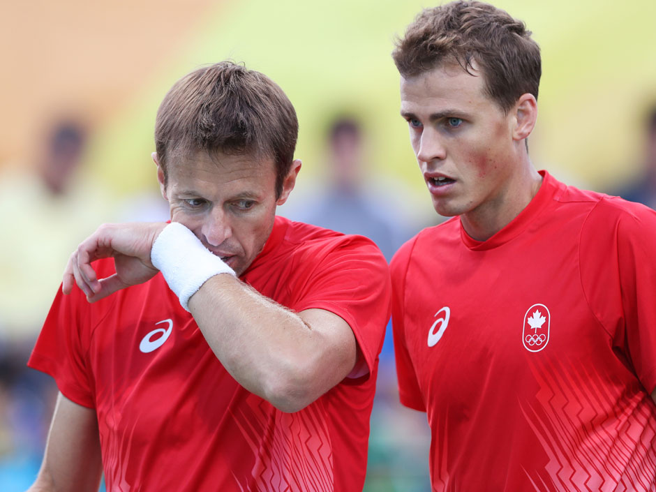 Daniel Nestor and Vasek Pospisil show their concern after losing a point against Rafael Nadal and Marc Lopez