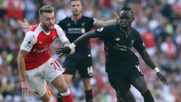 Liverpool's Sadio Mane right breaks away from Arsenal's Calum Chambers during the English Premier League soccer match between Arsenal and Liverpool at the Emirates Stadium in London. | AP