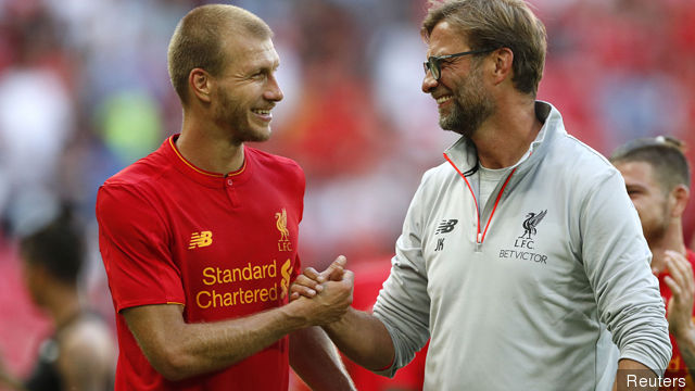 Liverpool's Ragnar Klavan celebrates with manager Juergen Klopp after the match