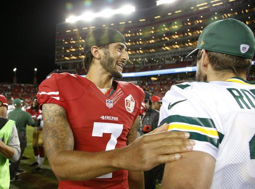 San Francisco 49ers quarterback Colin Kaepernick left greets Green Bay Packers quarterback Aaron Rodgers at the end of an NFL preseason football game Friday Aug. 26 2016 in Santa Clara Calif. Green Bay won 21-10