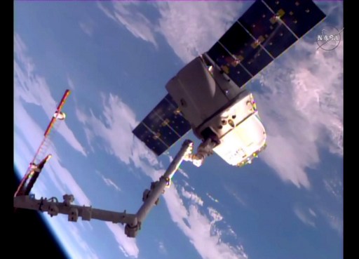 NASA TV frame grab shows the SpaceX Dragon cargo ship at the end of the Canada arm prior to release for departure from the International Space Station.  AFP