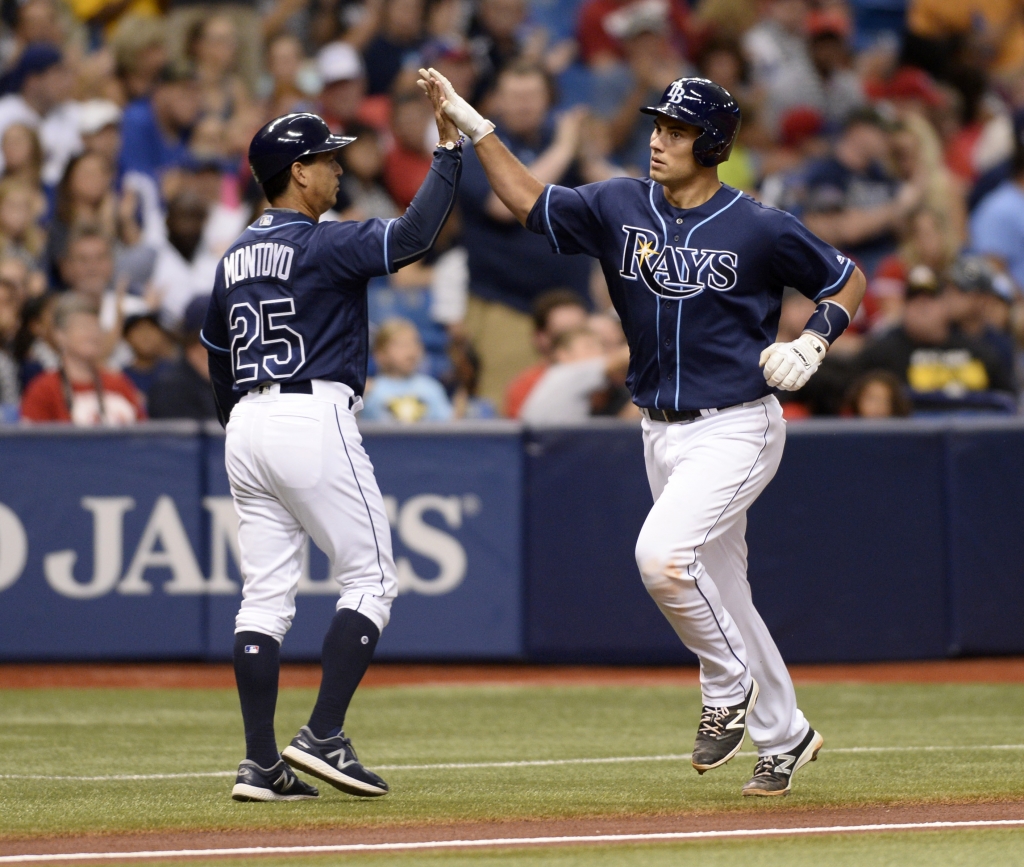 Tampa Bay Rays catcher Luke Maile is congratulated by Tampa Bay Rays third base coach Charlie Montoyo after his home run against the Texas Rangers during the 2nd inning of a baseball game Saturday Aug. 20 2016 in St. Petersburg Fla. (AP Pho