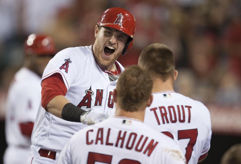 Los Angeles’ Jett Bandy celebrates his solo home run against the Mariners. The Angels won 7-6