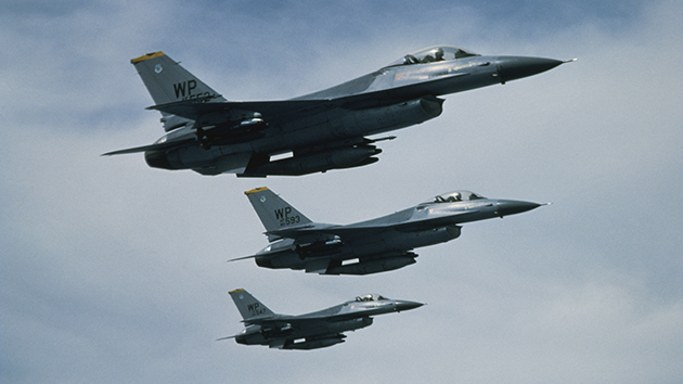 Low angle view of three F-16 Fighting Falcons flying in formation