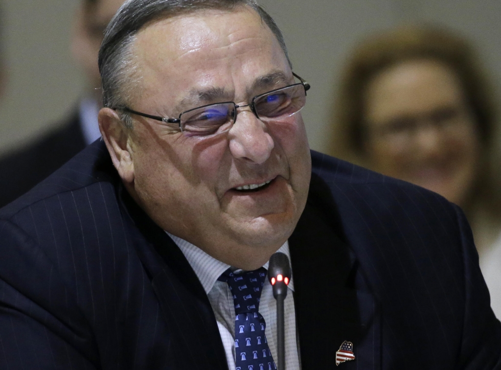 Maine Gov. Paul Le Page laughs as he speaks during a conference of New England's governors and eastern Canada's premiers to discuss closer regional collaboration Monday Aug. 29 2016 in Boston