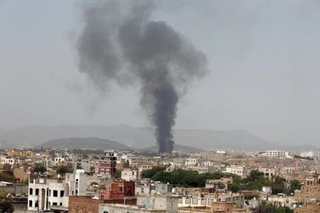 Smoke rises from a snack food factory after a Saudi-led air strike hit it in Sanaa Yemen