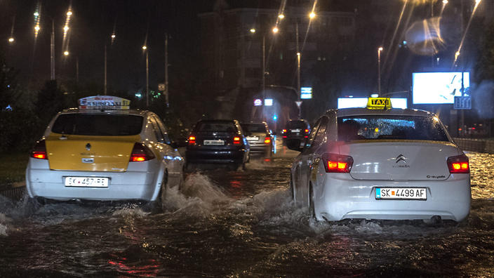 Macedonian police says at least 15 people are dead in floods after storm hit the capital Skopje