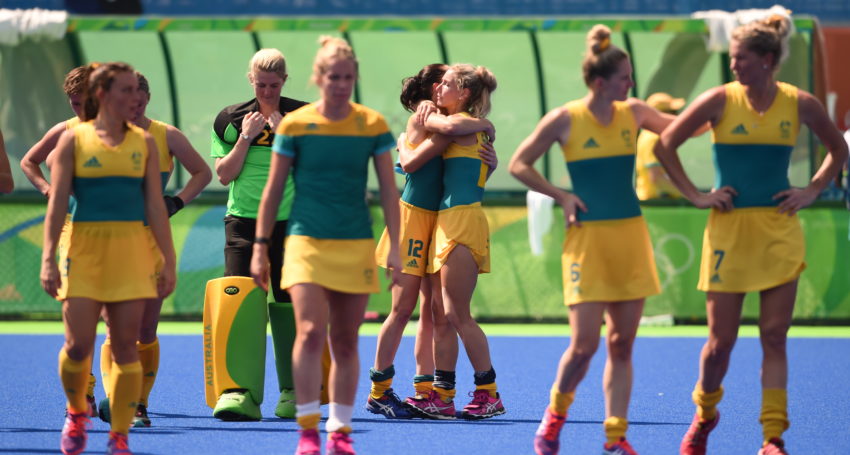 Madonna King is consoled at the end of play in the Women's Hockey Quarterfinal between New Zealand and Australia