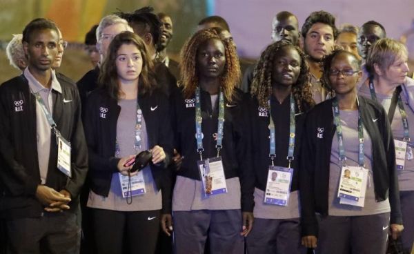 Members of the Refugee Olympic Team watch