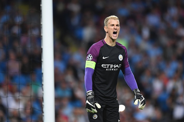 Manchester City's English goalkeeper Joe Hart shouts from the mouth of his goal during the UEFA Champions League second leg play-off football match between Manchester City and Steaua Bucharest at the Etihad Stadium in Manchester north west England on Aug