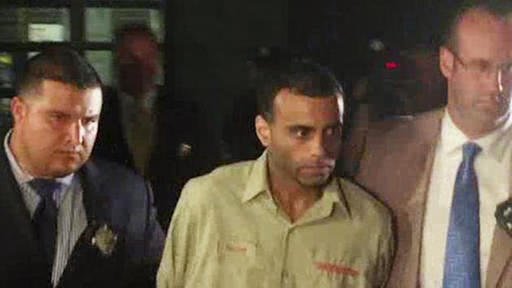 In this video image provided by WABC-TV New York police officers walk with Oscar Morel center of Brooklyn in New York on Monday Aug. 16 2016. Police arrested and charged Morel with murder late Monday night in the brazen daytime shooting deaths of