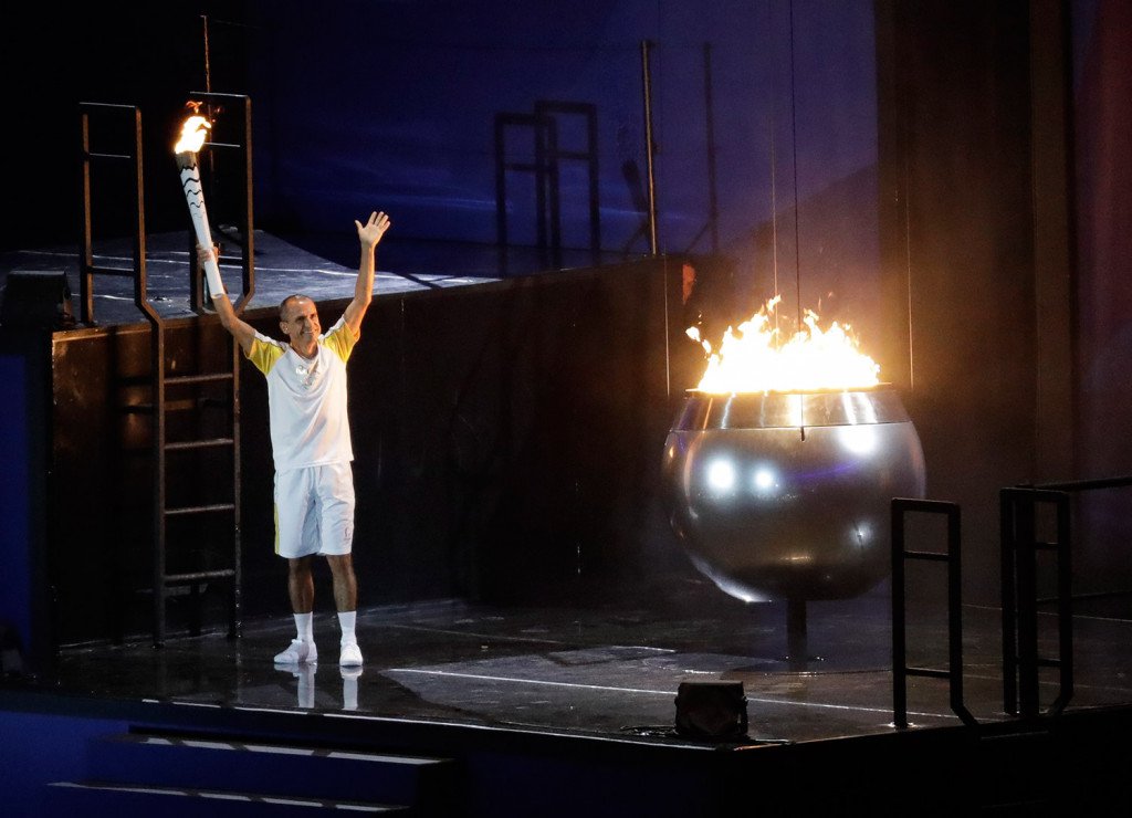 Brazilian marathoner Vanderlei de Lima lights the Olympic flame to open the 2016 Summer Olympics in Rio de Janeiro