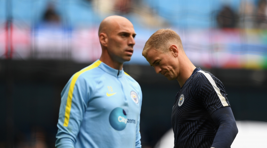 MANCHESTER ENGLAND- AUGUST 13 Manchester City goalkeepers Willy Caballero and Joe Hart look on during the warm up before the Premier League match between Manchester City and Sunderland at Etihad Stadium