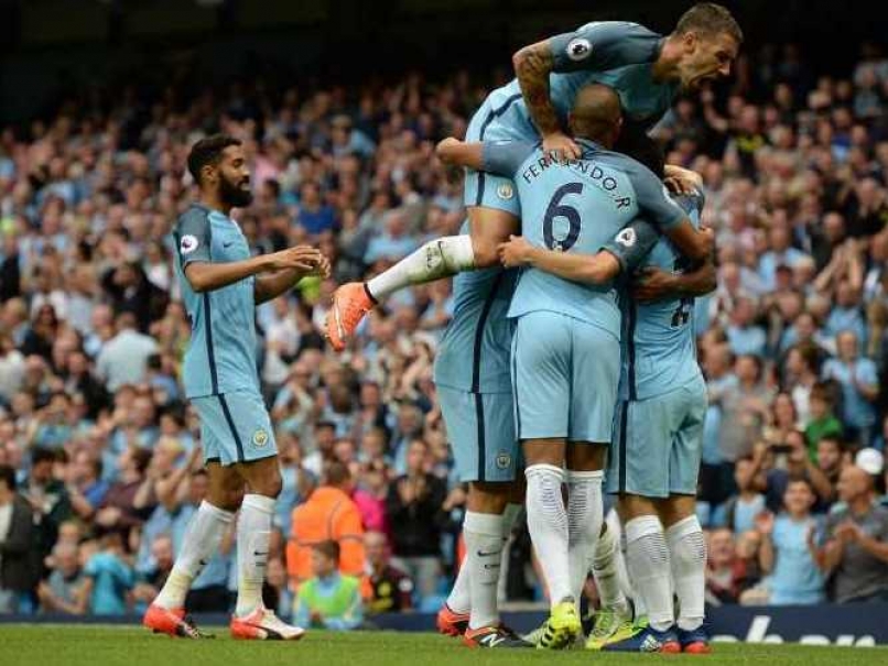 Manchester City players celebrate after a goal against West Ham in Manchester on Sunday