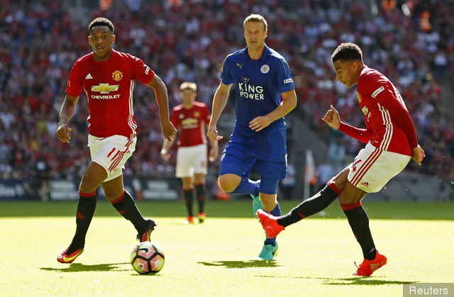 Manchester United's Jesse Lingard scores their first goal