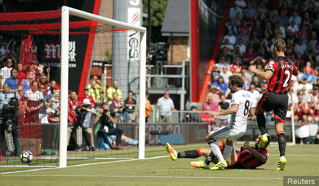 Manchester United's Juan Mata scores their first goal