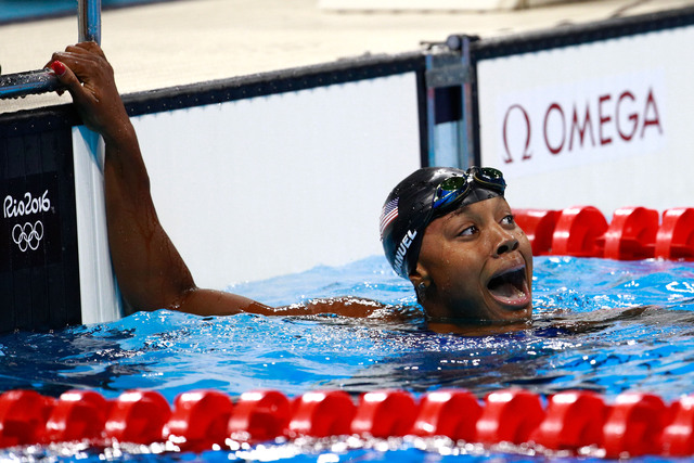 Manuel becomes 1st African American woman to win swim gold