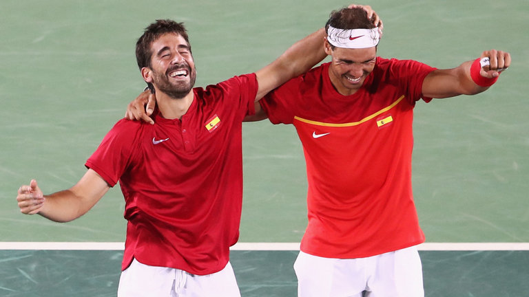 Marc Lopez and Rafa Nadal celebrate their win in the men's doubles final