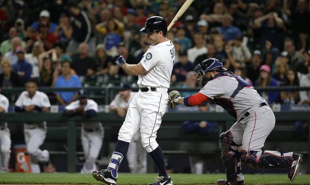 Boston Red Sox catcher Sandy Leon applies the tag as Seattle Mariners&#039 Seth Smith strikes out to end the 11th inning of a baseball game Thursday Aug. 4 2016 in Seattle. The Red Sox beat the Mariners 3-2 in 11 innings