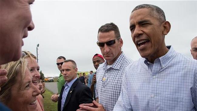 US President Barack Obama greets well-wishers upon arrival at Martha's Vineyard an island off the coast of Massachusetts