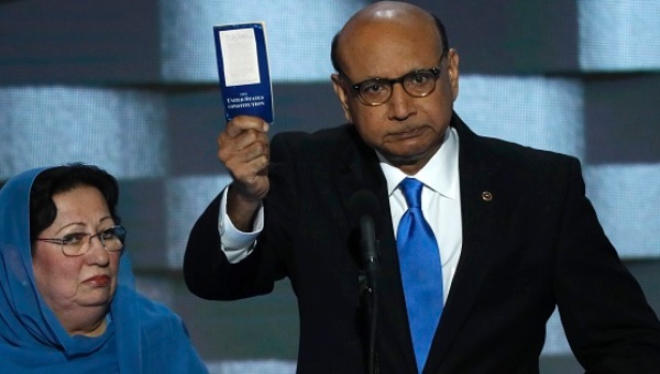 Khizr Khan with his wife Ghazala offers to loan his copy of the Constitution to Donald Trump as he speaks on the last night of the Democratic National Convention