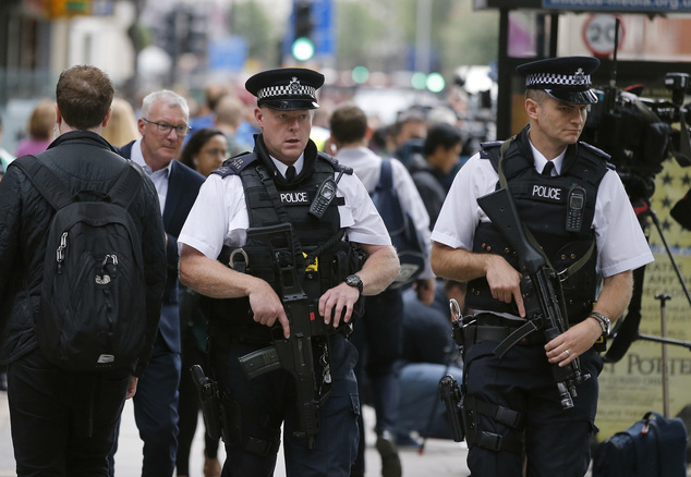 Police guard Russell Square following a knife attack in London Thursday Aug. 4 2016. Terrorism is being examined as a potential motive for a knife rampage